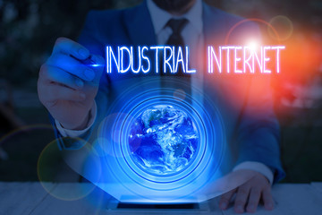 Conceptual hand writing showing Industrial Internet. Concept meaning use of the internet of things in industrial sectors Elements of this image furnished by NASA