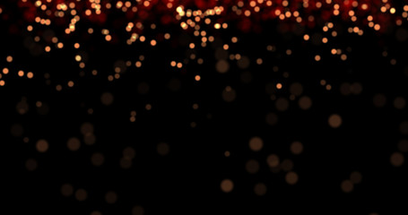 Flying dust particles on a black background