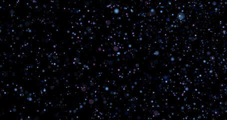 Flying dust particles on a black background