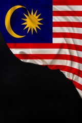vertical colored national flag of the modern state of Malaysia, beautiful silk, black blank, concept of tourism, economy, politics, emigration, independence day, copy space, template