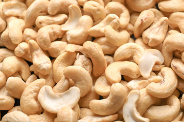 Many tasty cashew nuts as background