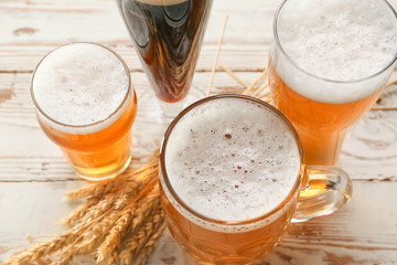 Glassware with fresh beer on table