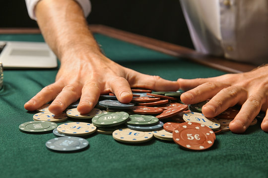 Young man playing in casino, closeup