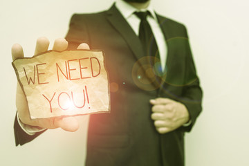 Conceptual hand writing showing We Need You. Concept meaning asking someone to work together for...