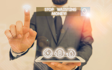 Writing note showing Stop Wasting Money. Business concept for advicing demonstrating or group to...