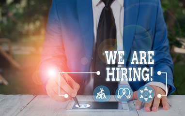 Conceptual hand writing showing We Are Hiring. Concept meaning recently you employ someone or pay...
