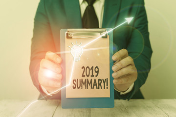 Writing note showing 2019 Summary. Business concept for summarizing past year events main actions or good shows