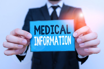 Writing note showing Medical Information. Business concept for Healthrelated information of a patient or a demonstrating Male human wear formal work suit with office look hold book