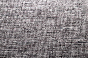 Gray textured wall. woven background close up. weaving texture