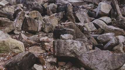 Pile of stones. heap of rocks. ruins of destroyed buildings