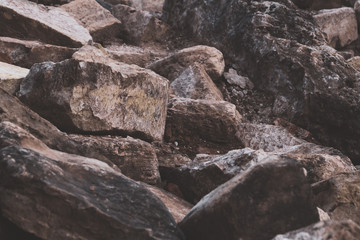Fototapeta premium Pile of stones. heap of rocks. ruins of destroyed buildings