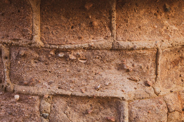 Rocky brick wall. stone wall background. abstract brown grunge texture. old masonry