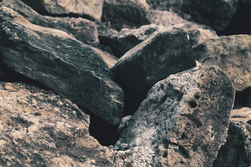 Pile of stones. heap of rocks. ruins of destroyed buildings