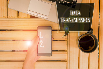 Handwriting text Data Transmission. Conceptual photo sending data electronically over a communications network woman computer smartphone drink mug office supplies technological devices
