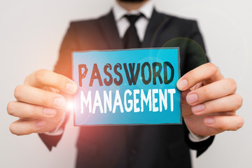 Writing note showing Password Management. Business concept for software used to help users better analysisage passwords Male human wear formal work suit with office look hold book