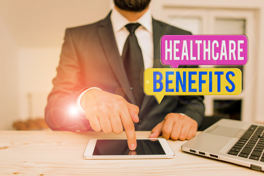 Word writing text Healthcare Benefits. Business photo showcasing use the health services without risk of financial ruin Male human wear formal clothes present presentation use hi tech smartphone