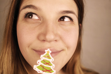 Young girl with a christmas tree. Happy New Year.