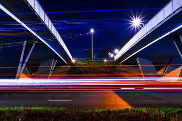 Fototapeta na wymiar J.F. Kennedylaan Eindhoven, The Netherlands, by night. Long exosure with light trails and copy space.