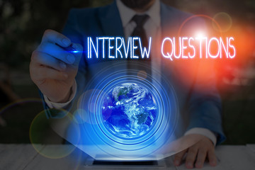 Conceptual hand writing showing Interview Questions. Concept meaning Typical topic being ask or inquire during an interview Elements of this image furnished by NASA