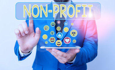 Conceptual hand writing showing Non Profit. Concept meaning not making or conducted primarily to make profit organization