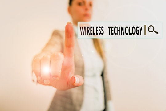 Conceptual hand writing showing Wireless Technology. Concept meaning a technology that allows wireless communication Digital business concept with business woman