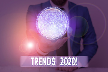 Writing note showing Trends 2020. Business concept for general direction in which something is developing or changing Elements of this image furnished by NASA