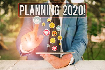 Writing note showing Planning 2020. Business concept for process of making plans for something next year