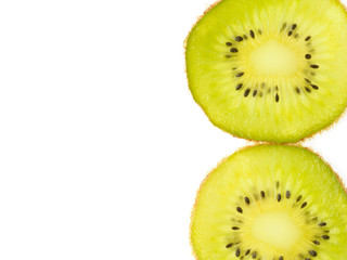 Two slices of kiwi vertically on a white background