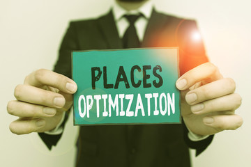 Writing note showing Places Optimization. Business concept for improve searching for something in a certain location Male human wear formal work suit with office look hold book