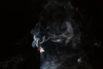 abstract background of smoke from a stick of incense close up with copy space