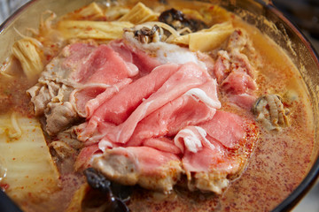Pork in Korean kimchi and seafood hot pot 