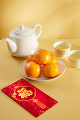 Chinese new year food and drink still life with red envelope Ang pao.