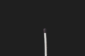 Match sticks over black background. Matte look and selective focus
