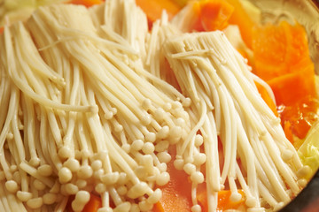 Enoki mushroom and carrot in homemade hot pot 