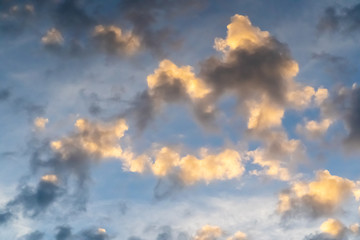 Golden and grey clouds in sky