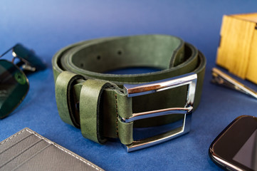 Genuine leather belt close up on blue background