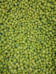 Fresh lotus seeds that are full of greens.