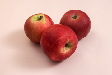 Fresh Harvested red apple lies on trend pink background. Fruit with vitamin C, Keratin. Natural Organic Top View Flat Lay. Rustic Style. Country Village Agriculture concept