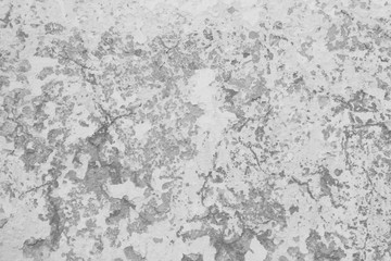 black and white texture with different cracks and chips with different relief and transitions white wall with history and cracks with unusual transitions of color and texture
