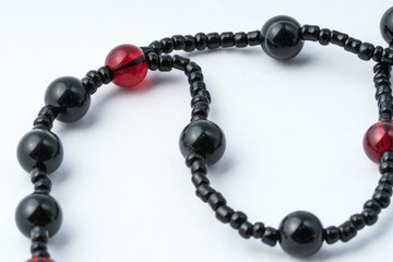 Handmade rosary necklace made of beads, black agate and artificial red garnet