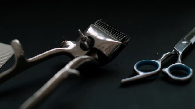 vintage barber tools dangerous razor hairdressing scissors old manual clipper comb shaving brush. on black background