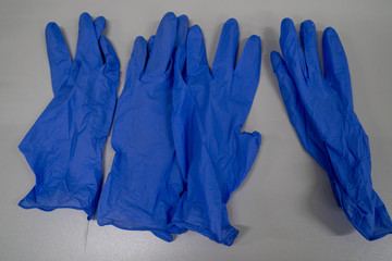 the blue plastic gloves used in medical and science.