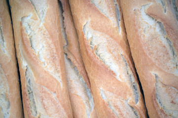 Five fresh baguettes side by side on a market in Alicante-Spain.
