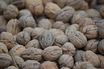 A heap of fresh harvest walnuts on a market in Spain.