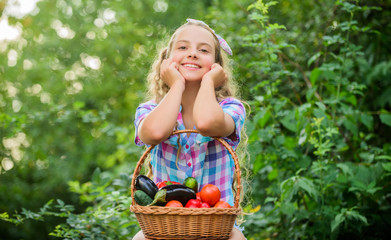 Healthy lifestyle. Kid hold basket with vegetables nature background. Eco farming. Eat healthy....