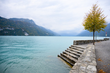 Views of the valley and lake of Brienz (Brienzersee) on a rainy and foggy day.