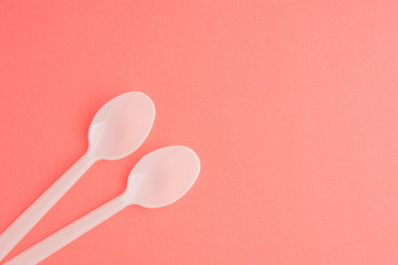 Plastic Spoons On Pink Background, White Plastic Spoons