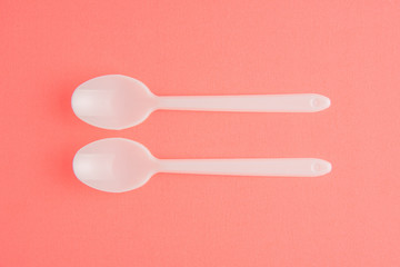 Plastic Spoons On Pink Background, White Plastic Spoons