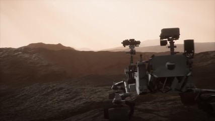 Curiosity Mars Rover exploring the surface of red planet. Elements of this image furnished by NASA.