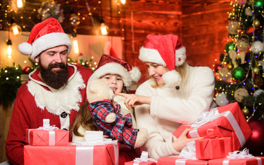 Happy family celebrate new year. Winter holidays. Shopping sales. xmas gift boxes. Happy New 2020 Year. merry christmas. Father and mother love daughter. small child and parents in santa hat